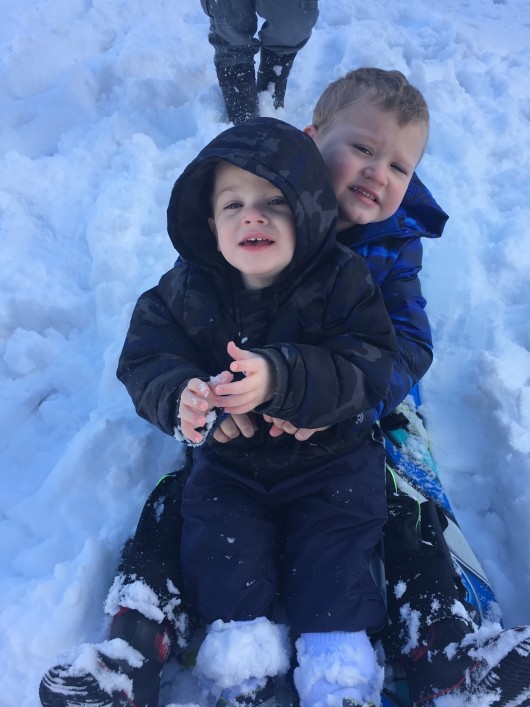 Sledding with cousin Blake and our neighbors.